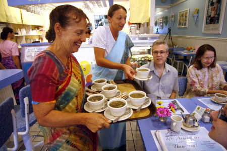 (PHOTO BY DOUGLAS R. CLIFFORD | TIMES) Drishti Pliske of Miami, left, and Kamila Hozlarova of Hudson serve spinach-artichoke soup to James Hughes of Oldsmar, Bonnie Starr of Largo and Betsie Hughes of Oldsmar, at lower right, during a 10th anniversary celebration dinner Sunday at Consciousness Blossoms, a vegetarian restaurant in Palm Harbor that shares a message of peace. (PHOTO BY DOUGLAS R. CLIFFORD | TIMES) Drishti Pliske of Miami, left, and Kamila Hozlarova of Hudson serve spinach-artichoke soup to James Hughes of Oldsmar, Bonnie Starr of Largo and Betsie Hughes of Oldsmar, at lower right, during a 10th anniversary celebration dinner Sunday at Consciousness Blossoms, a vegetarian restaurant in Palm Harbor that shares a message of peace.