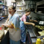 (PHOTO BY DOUGLAS R. CLIFFORD | TIMES) Linda Schloegel, left, and Hurwit, both of Safety Harbor, prepare the vegetarian dinner Sunday night. (PHOTO BY DOUGLAS R. CLIFFORD | TIMES) Linda Schloegel, left, and Hurwit, both of Safety Harbor, prepare the vegetarian dinner Sunday night.